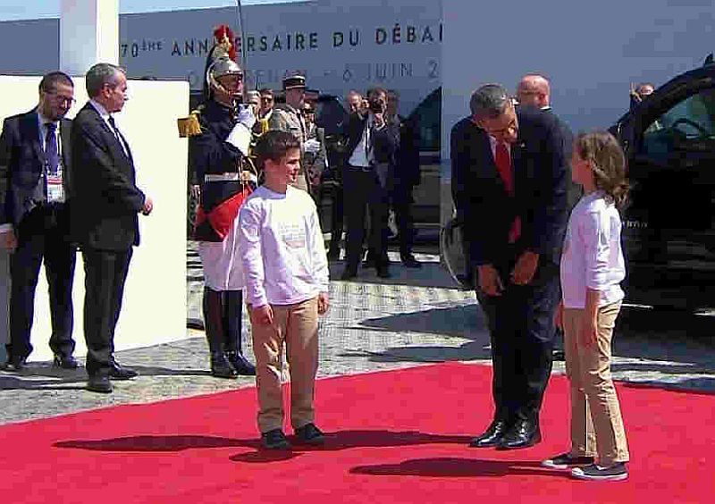 Obama welcomed by children 70 years d-day